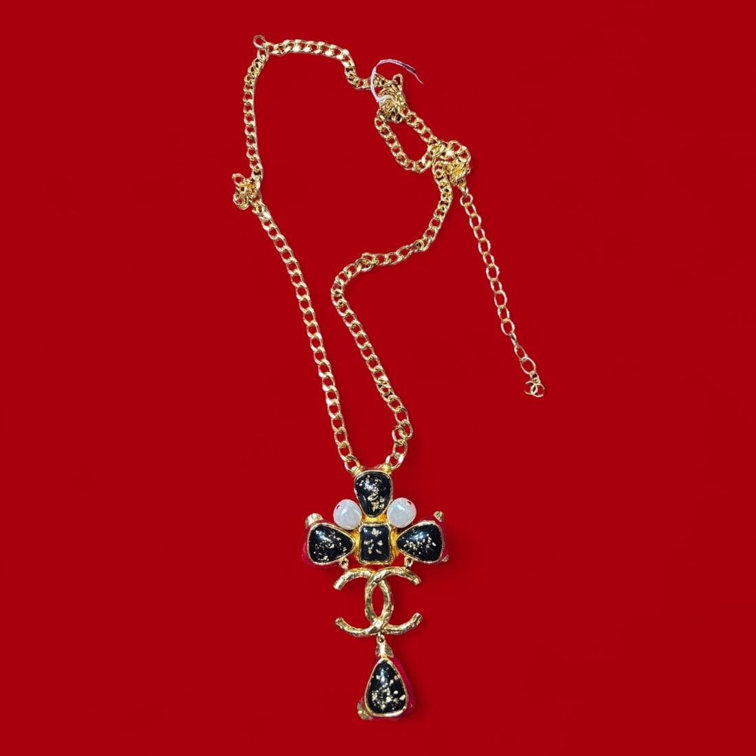 An authentic 18k Gold Plated Pearl & Black Enameled Chanel Necklace: An authentic 18k Gold Plated Pearl & Black Enameled Chanel Necklace. Stamped Chenel Hallmark On the Clasp. circa 2000