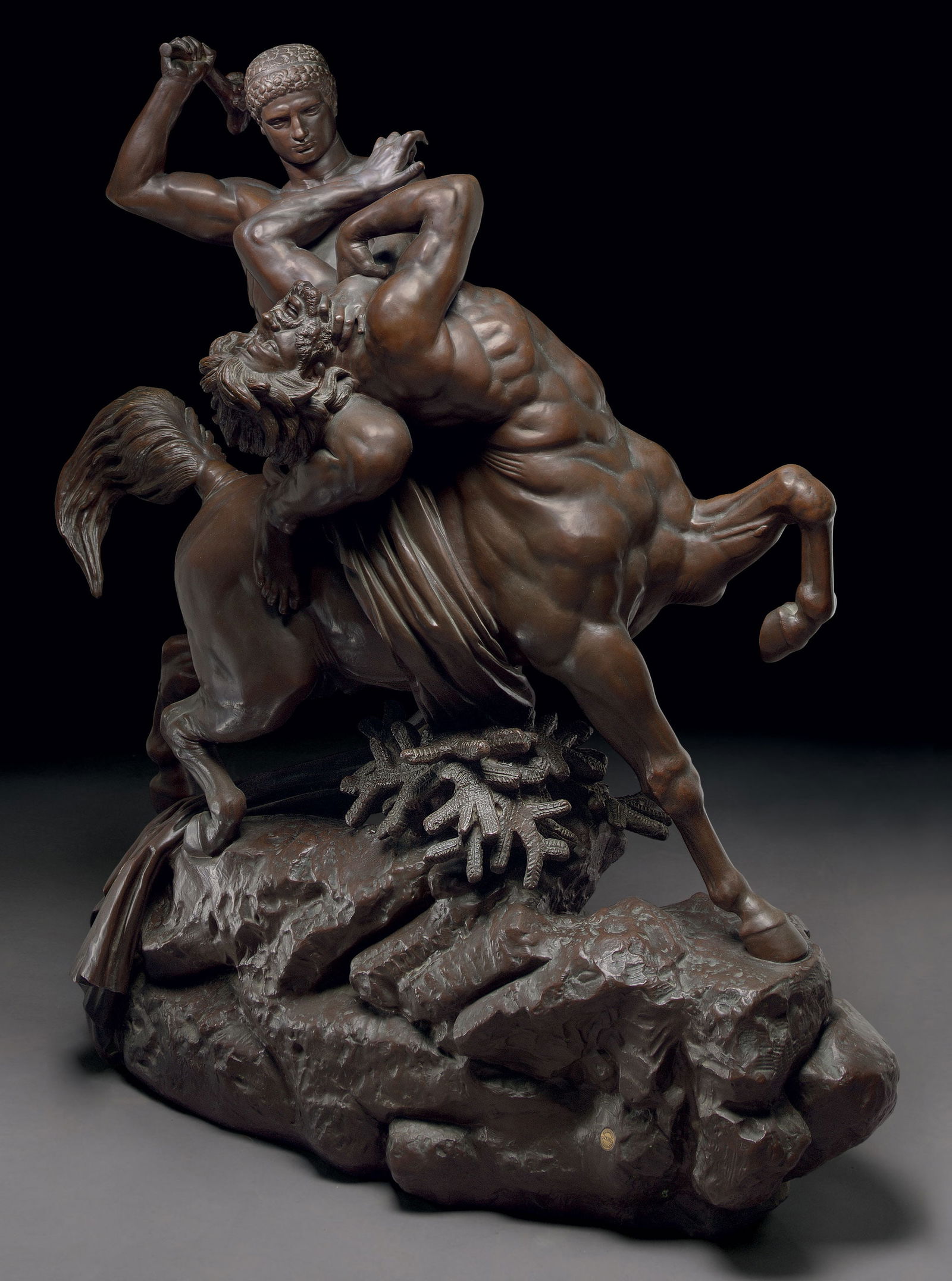 ANTOINE-LOUIS BARYE Cast By Barbedienne Retialed By Tiffany & Co: A LARGE AND RARE FRENCH PATINATED BRONZE FIGURAL GROUP ENTITLED 'THESEE COMBATTANT LE CENTAURE BIENOR' (THESEUS BATTLING THE CENTAUR BIENOR) A LARGE AND RARE FRENCH PATINATED BRONZE FIGURAL GROUP ENTI