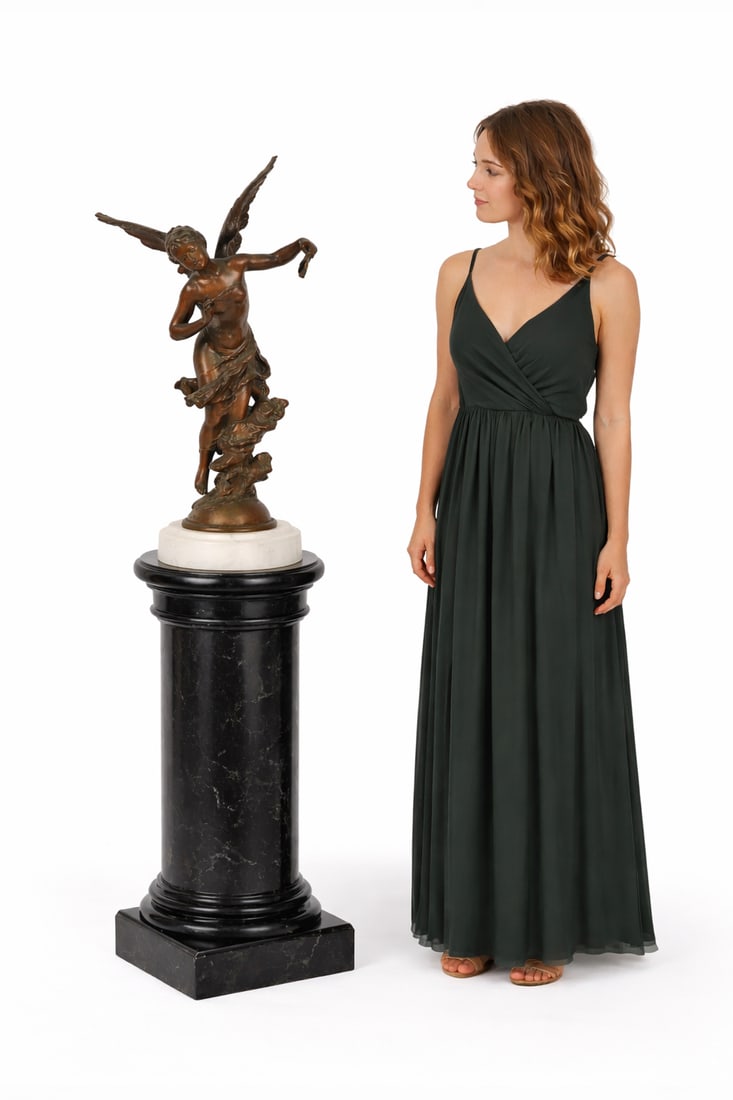 Mathurin Moreau (1822-1912): A finely cast patinated bronze sculpture depicting a graceful winged female figure in flowing drapery, poised in motion, raised on a swirling cloud-form base and mounted to a circular marble plinth.