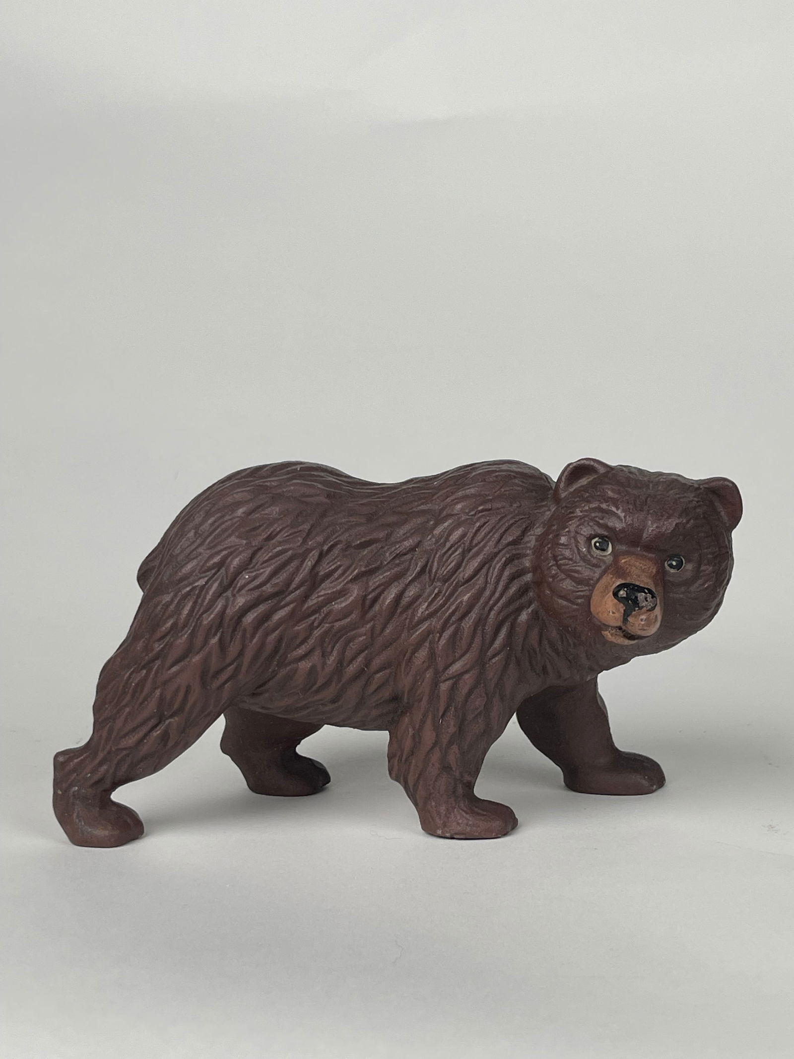 A Figure of a Walking Bear Doorstop: A Figure of a Walking Bear Doorstop. H: 4-1/2” W:7”
