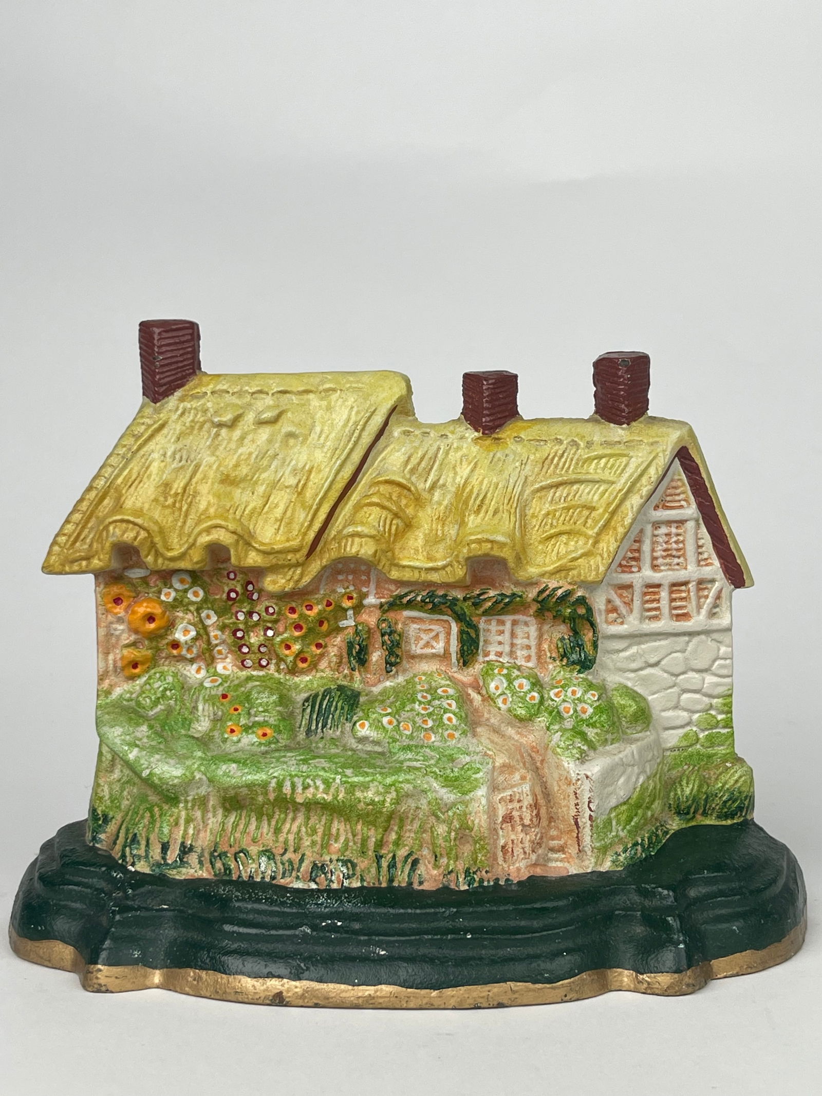 A Flowery Cottage Cast Iron Doorstop (1 of 6)