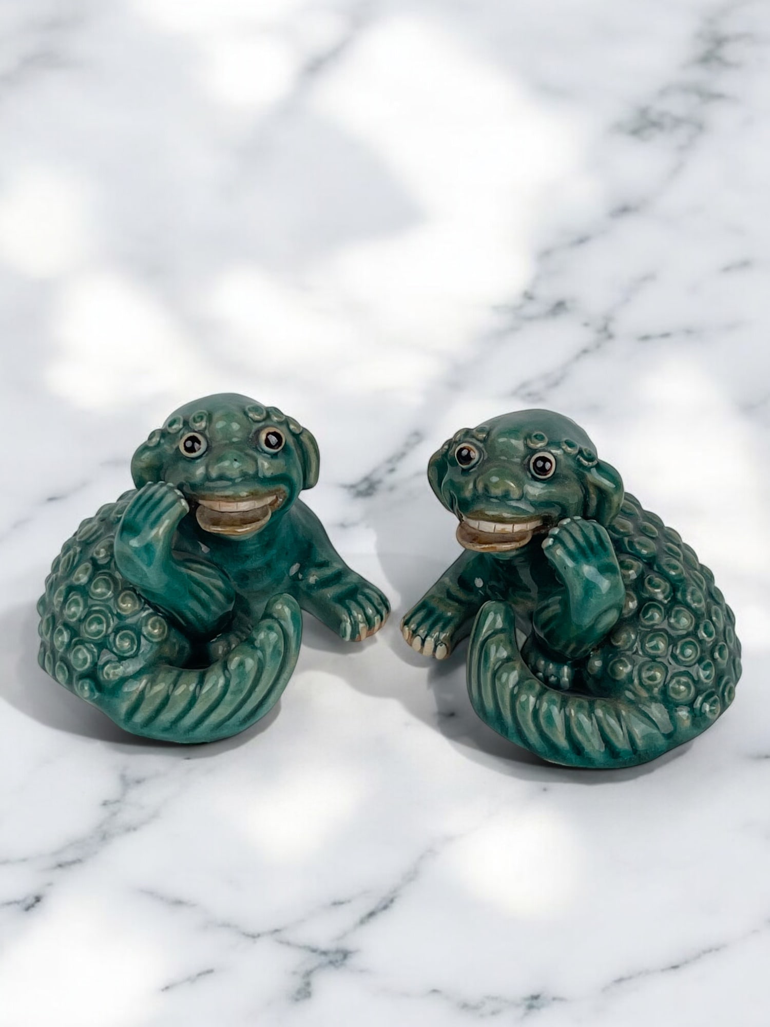 A Pair of Chinese Porcelain Foo Lions: A Pair of Chinese Porcelain Foo Lions. 3" x 3"