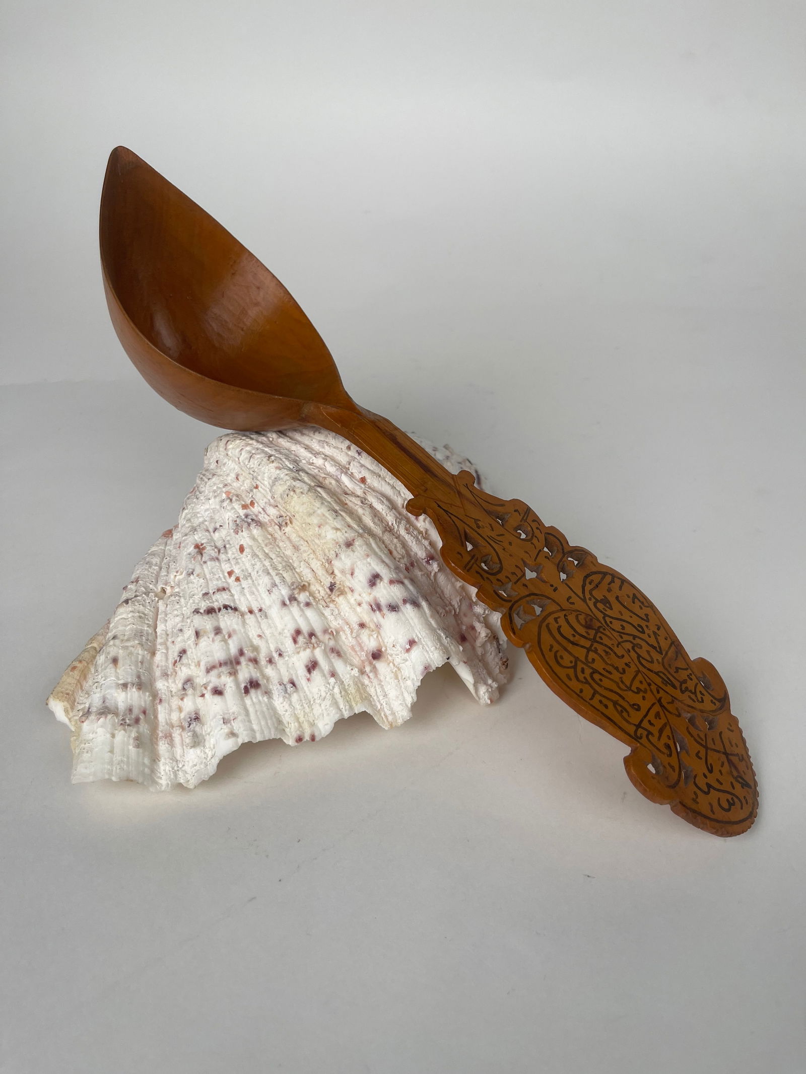 A Persian Qajar Hand Carved Wooden Sherbet Spoon: A Persian Qajar Hand Carved Wooden Sherbet Spoon . 11-1/2”