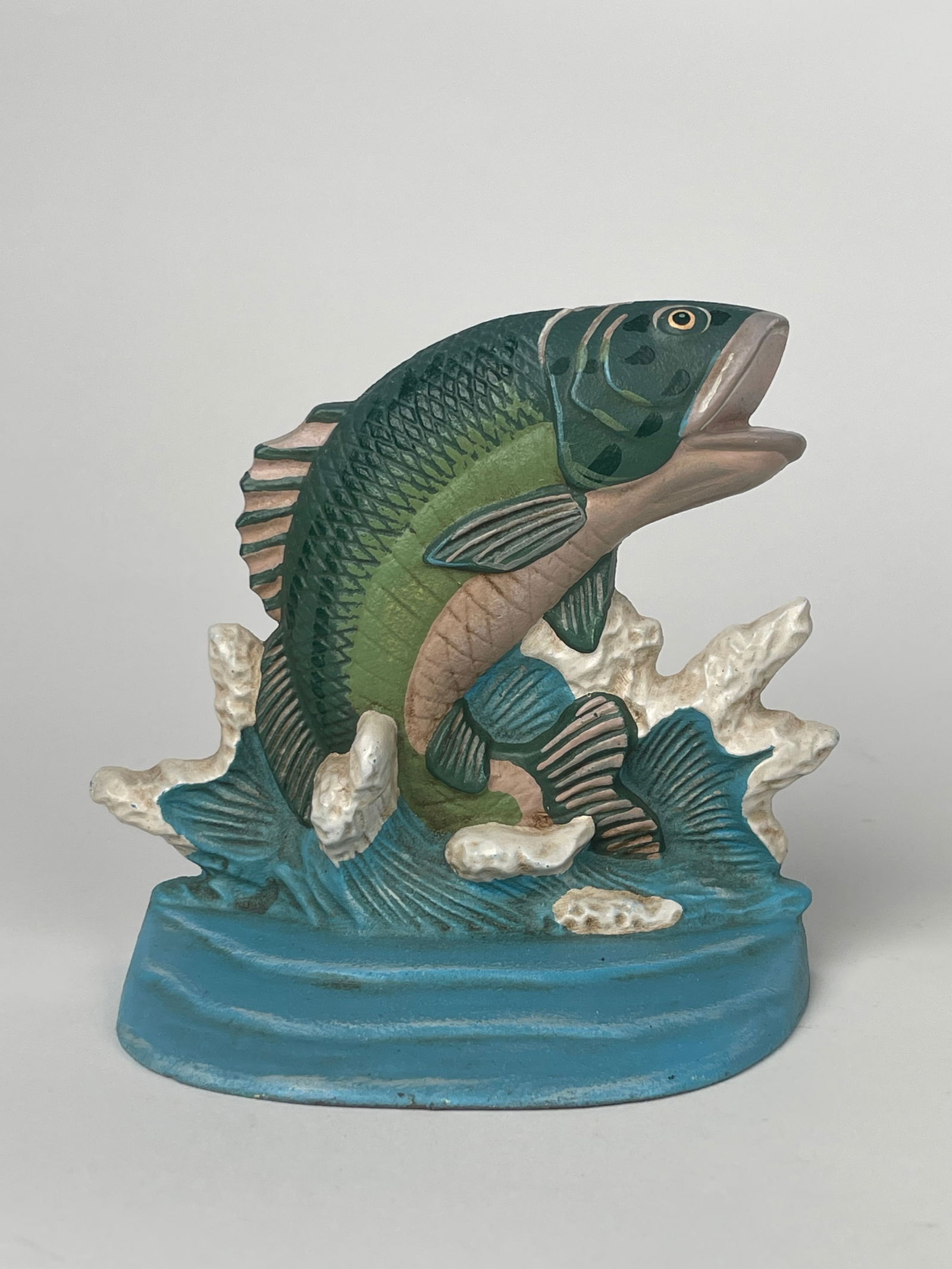 A Cast Iron Fish Swimming Through a Water Wave Doorstop (1 of 5)