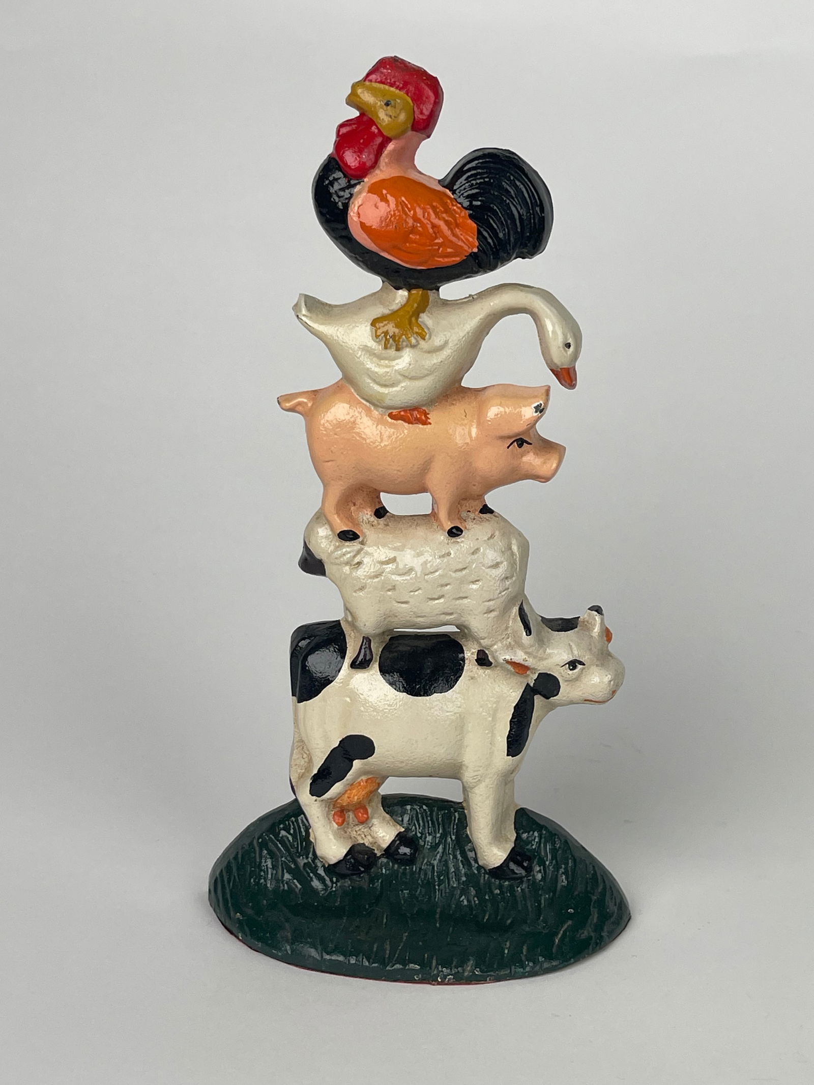 A Pile of Farm Animals Standing on Each Other Cast Iron Doorstop: A Pile of Farm Animals Standing on Each Other Cast Iron Doorstop. H:10-1/8” W:5-1/4”