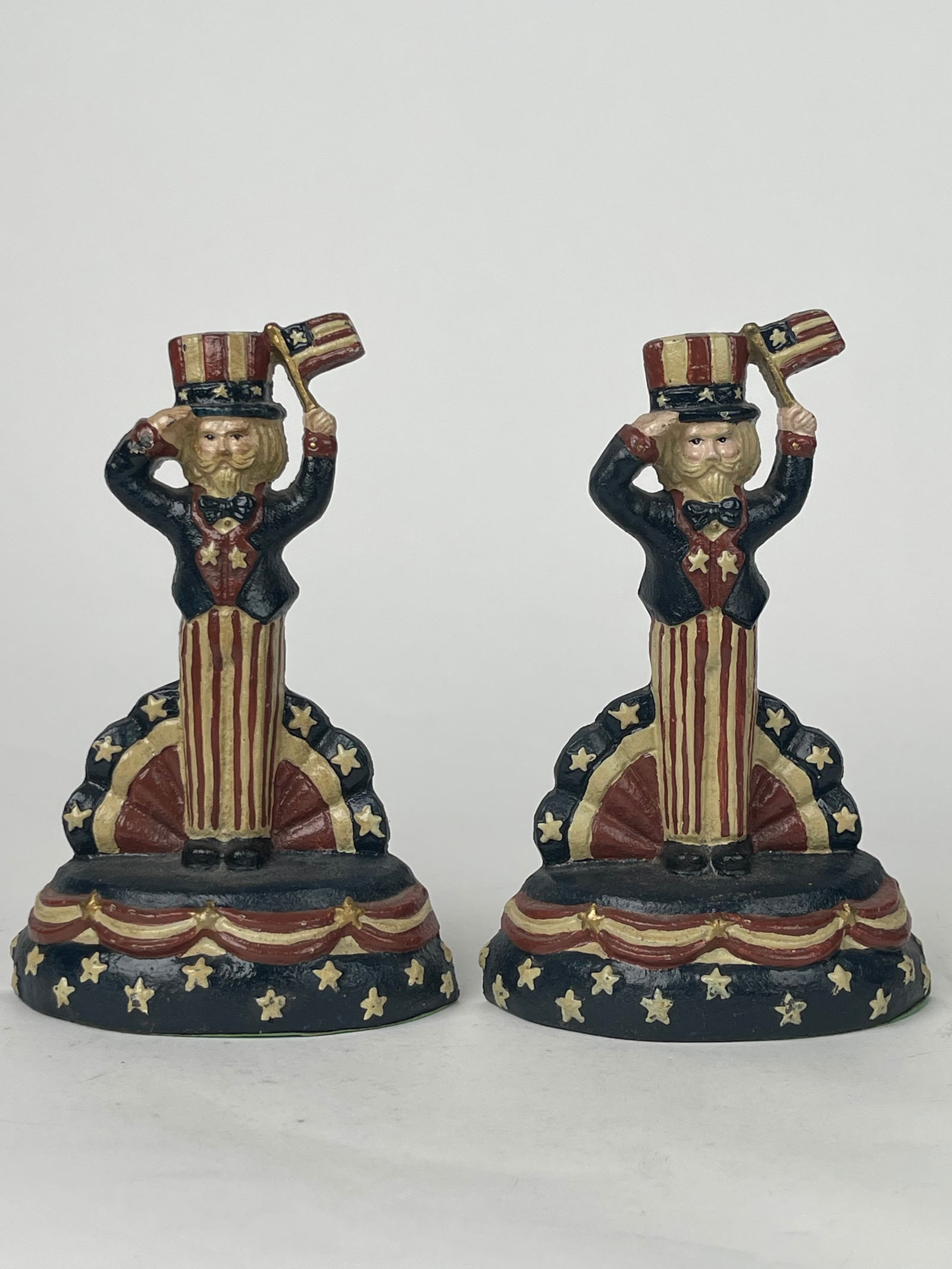 Pair Of Uncle Sam Cast Iron Door Stops: Pair Of Uncle Sam Cast Iron Door Stops. H: 8” W: 5”