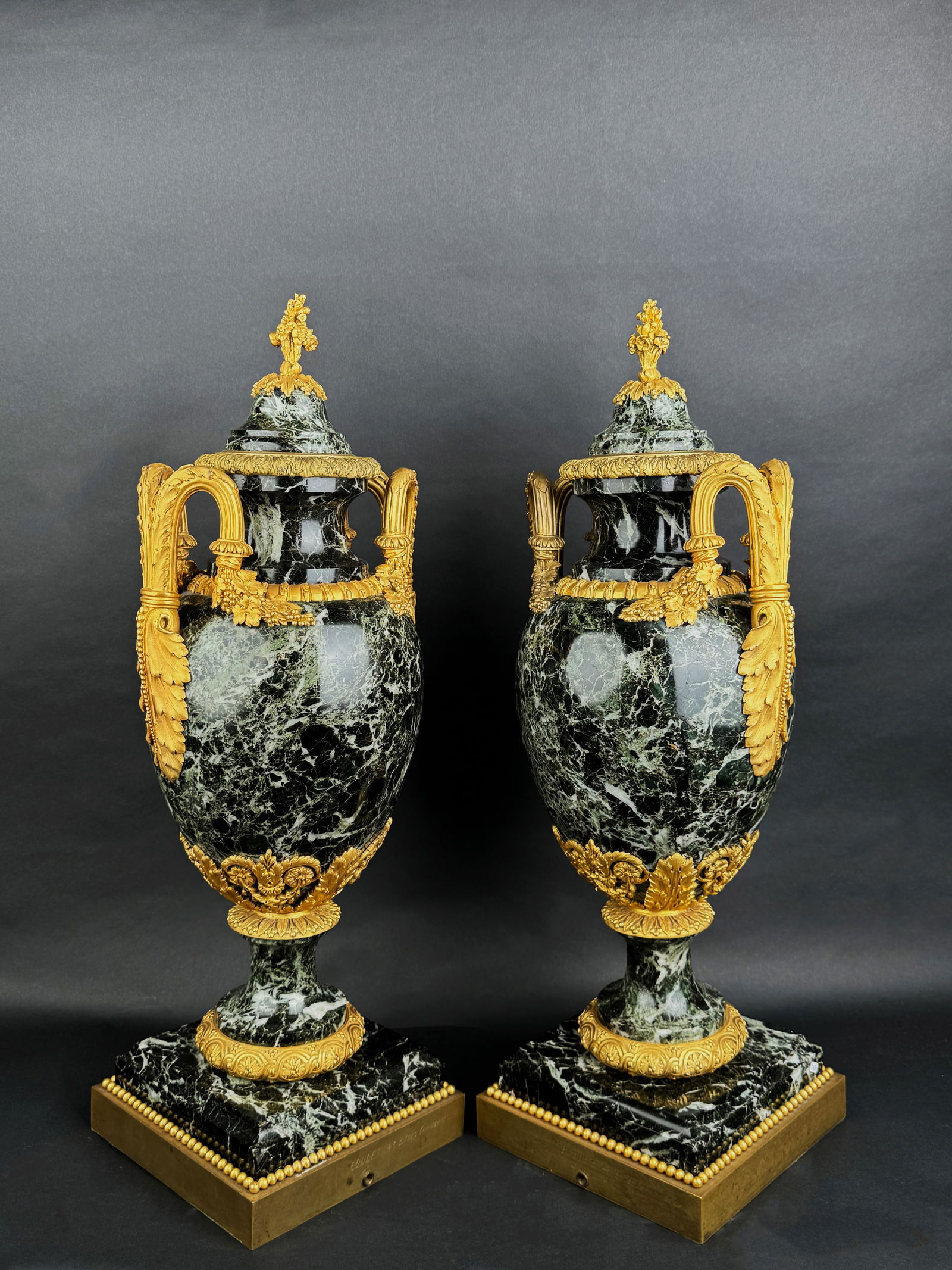 Large Pair Of 19th C. Ormolu Mounted Verde Antico Marble Vases: Large Pair Of 19th C. Ormolu Mounted Verde Antico Marble Urns. France, Circa 19th Century. By Maison Boudet. H: 28-1/2"D: 11"x9"