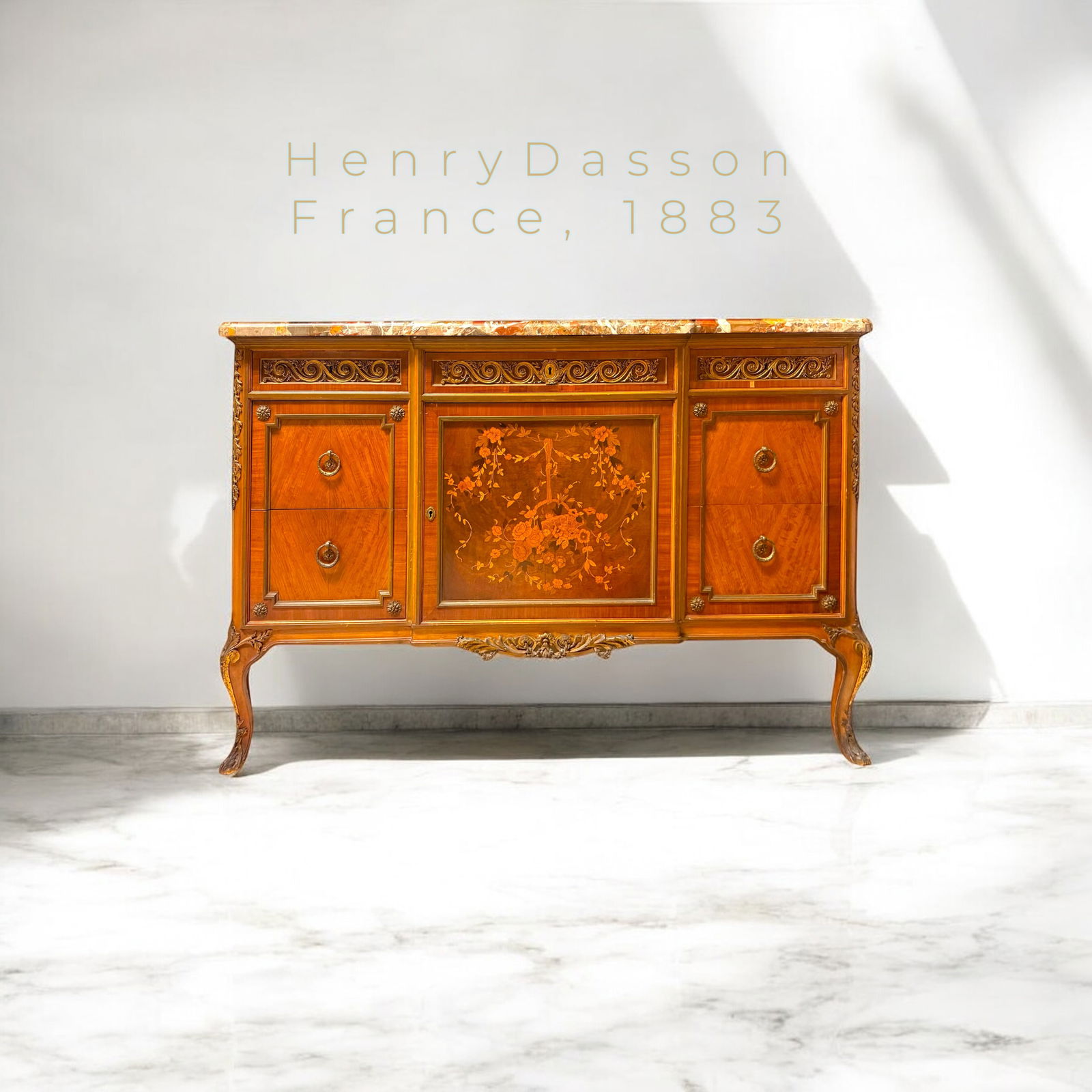 Henry Dasson, France, Circa 1883: A magnificent 19th-century gilt Bronze mounted marquetry commode, signed Henry Dasson, 1883, showcasing the unparalleled craftsmanship of one of France’s most renowned ébénistes. This exquisite ch