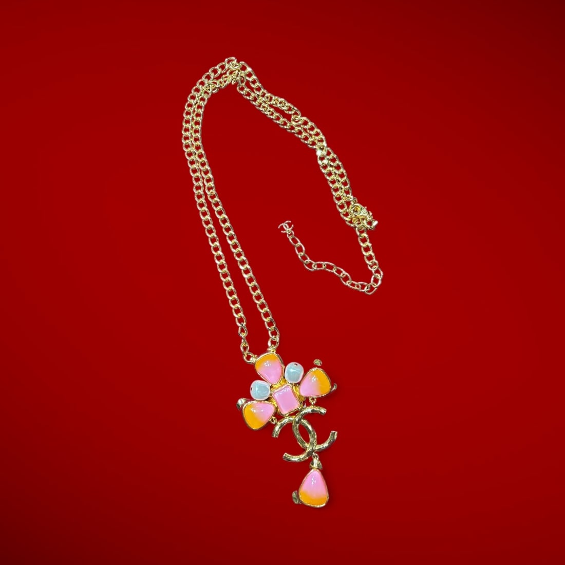 An Authentic 18k Gold Plated Pearl & Pink Enameled Chanel Necklace: An Authentic 18k Gold Plated Pearl & Pink Enameled Chanel Necklace. Stamped Chenel Hallmark On the Clasp. circa 2000