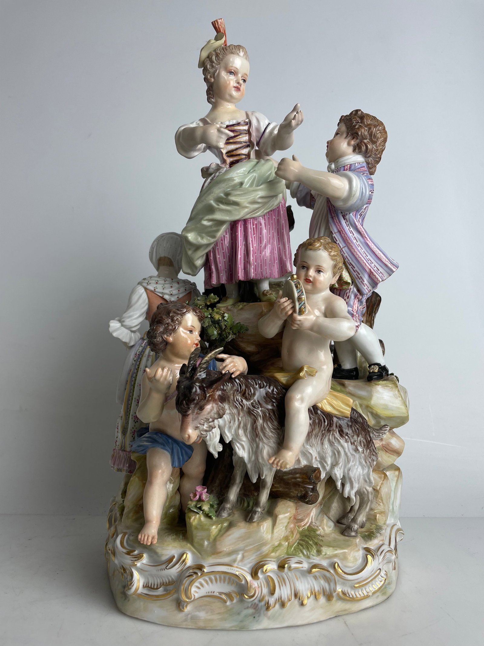 A Meissen Porcelain Hand Painted Group Sculpture: A Meissen Porcelain Hand Painted Group Sculpture.