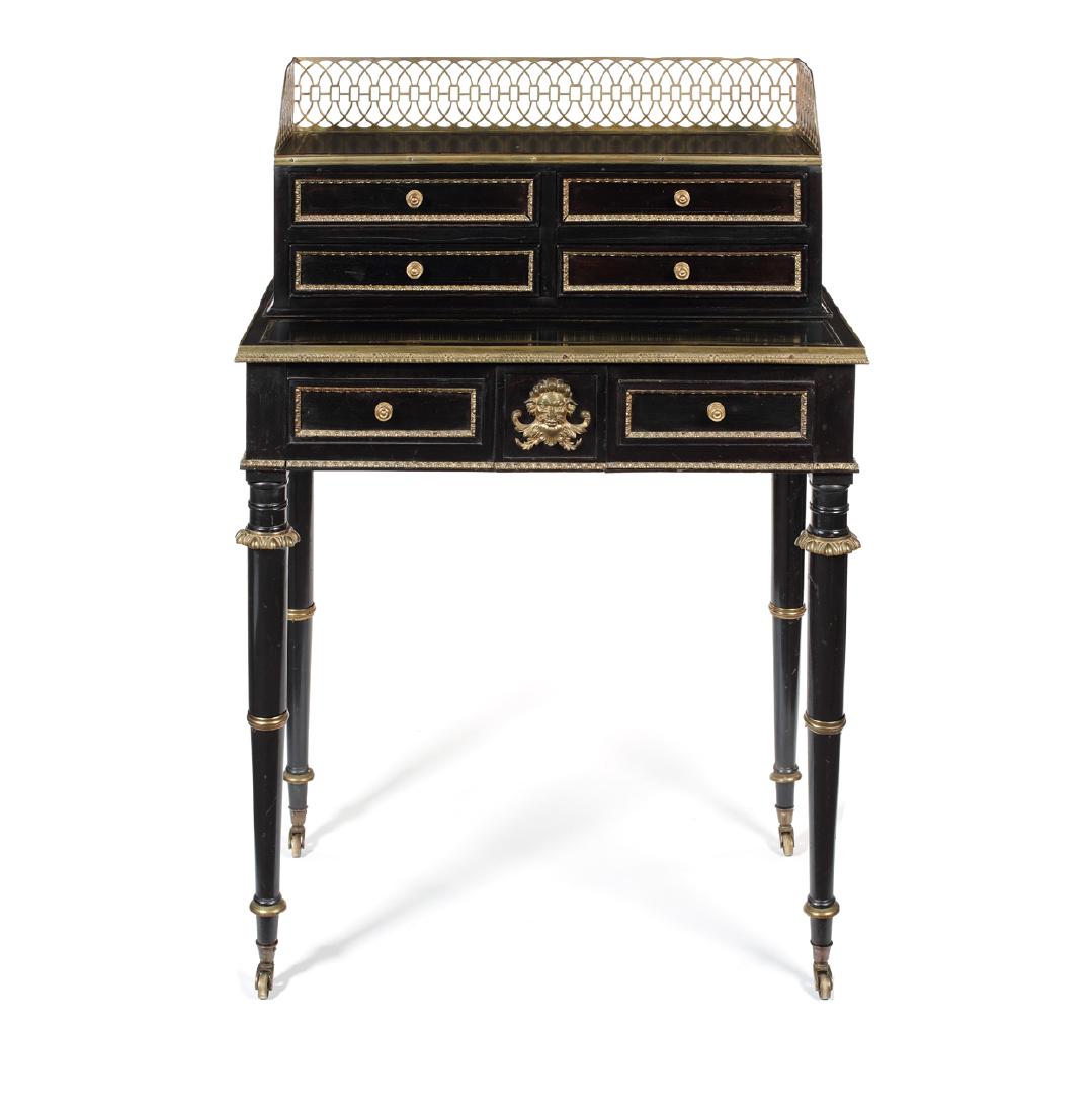 A Regency ebonised and gilt bronze mounted chiffonier: A Regency ebonised and gilt bronze mounted chiffonier attributed to John McLean The upper part with a pierced gilt brass three-quarter gallery and banded top above four drawers, the rectangular top ab