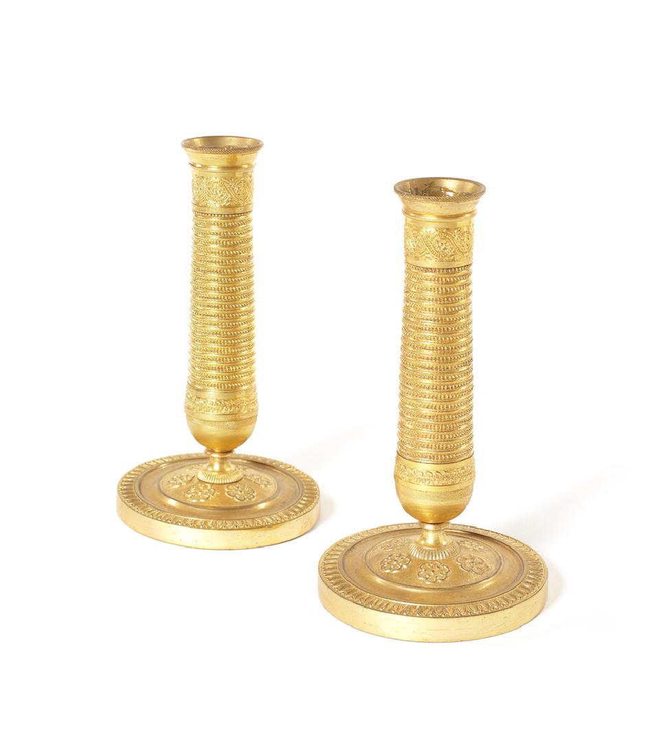 A pair of Empire gilt brass dwarf candlesticks (1 of 1)