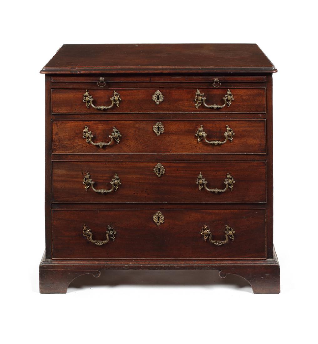 A small George III mahogany chest: A George III mahogany chest of small size in the manner of Thomas Chippendale The rectangular moulded edge top above a brushing slide and four long graduated drawers, on shaped bracket feet, 79.5cm wi