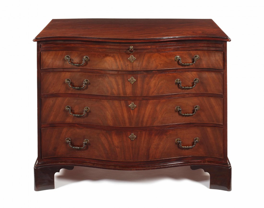 George III Chippendale mahogany chest: A George III mahogany serpentine chest possibly by Thomas Chippendale The rectangular moulded top above a baize lined slide and four long graduated drawers, on shaped bracket feet, 106cm wide, 61cm de