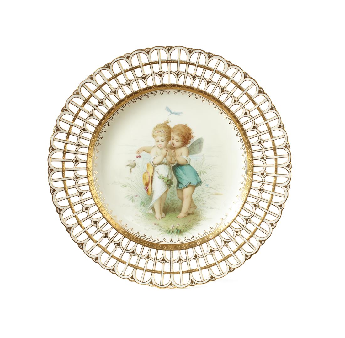 A group of three 19th century Minton lattice plates: A group of three 19th century Minton lattice plates decorated by Antonin Boullemier in the manner of William S Coleman Two of the plates with a buff ground to the centre decorated with two young