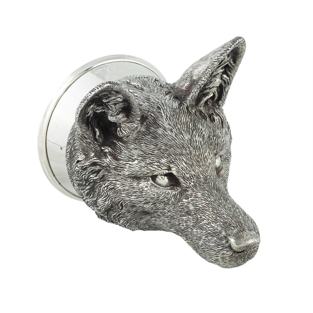 A Victorian silver fox head stirrup cup, 1878: A Victorian silver fox head stirrup cup by James Barclay Hennell, London, 1878 Realistically modelled, with plain rim and gilt interior, 13cm high, 11.4 oz. (356 gm.)