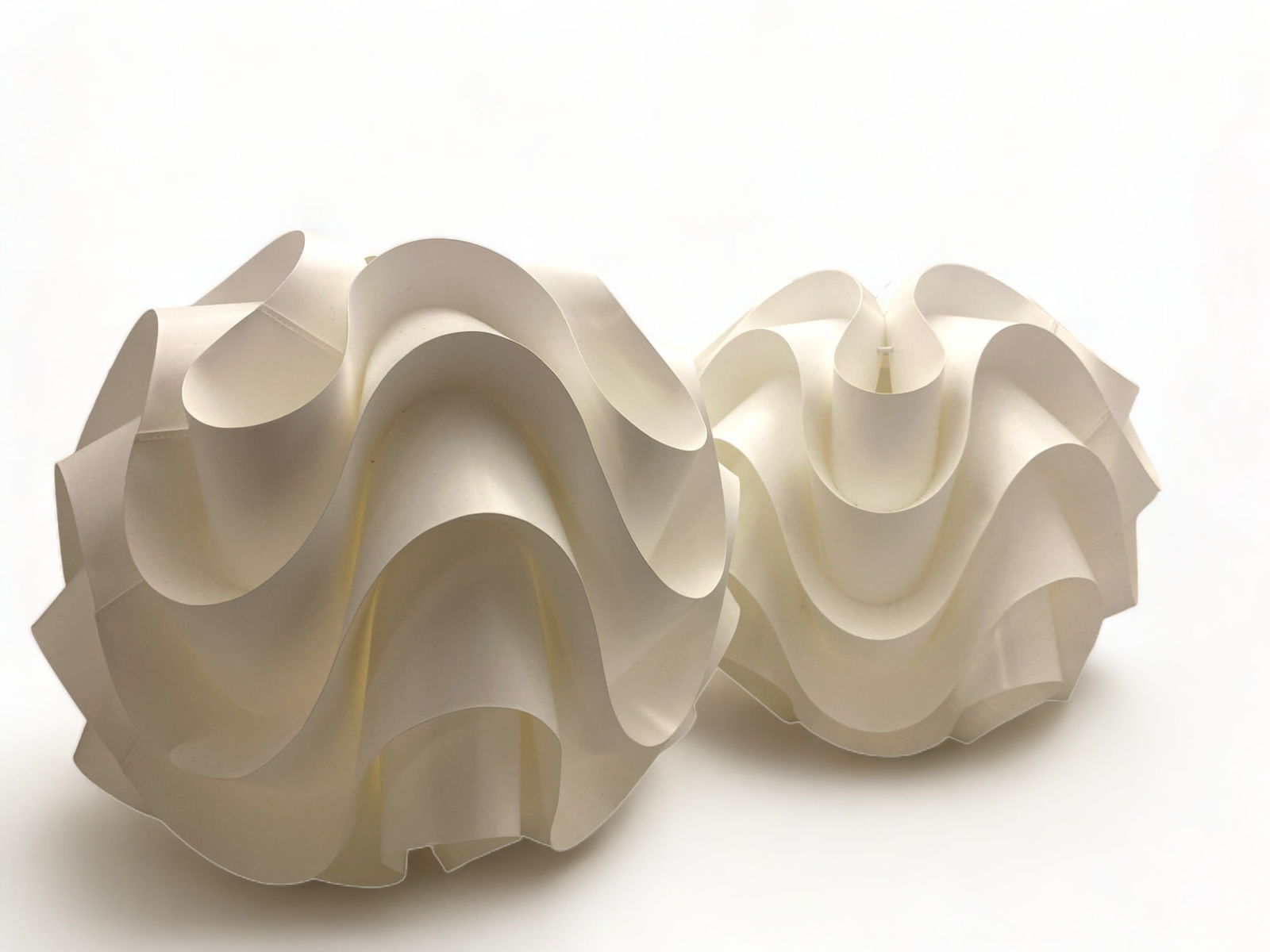 A pair of Le Klint 172 model lampshades designed by Poul Christiansen: A pair of Le Klint 172 model lampshades designed by Poul Christiansen 33cm diameter. (2)