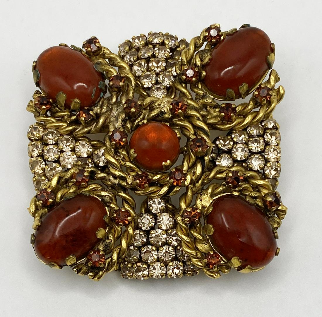 Medallion French Brooch.: Brooch designed as a medallion with 5 carnelian glass beads, settled in wired gild metal, embellished with diamonds and topaz rhinestones. Signed Made in France. Dimension 2¼ x 2¼ Inches