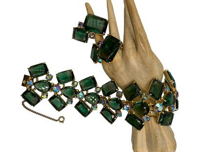 Elsa Schiaparelli Demi-Parure Bracelet + Earrings.: Articulate band bracelet. Open work design with faceted green crystal drops and emerald-cut green crystals, alternate with smaller iridescent round rhinestones. Matching clip earrings. Bracelet and ea