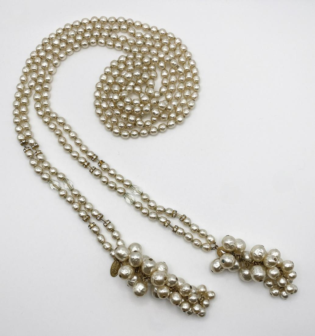 Miriam Haskell Pearls Open Tie Necklace.: Open tie necklace. Two long strands of fresh faux pearls, with glass diamonds and clear beads, ending with two cluster of faux pearls. Signature in oval tag Miriam Haskell