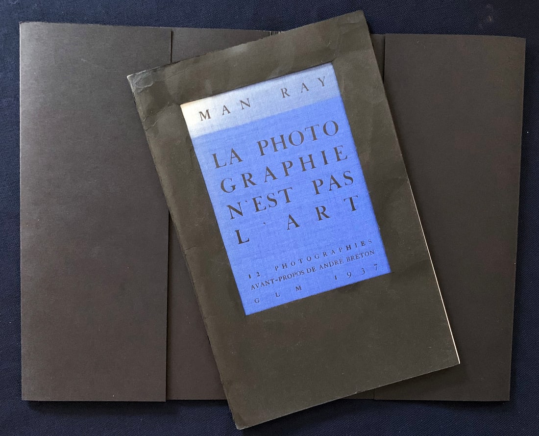Man Ray. La photographie n’est pas de l' art. 1937.: Editions GLM, Paris 1937. Man Ray, Andre Breton. Portfolio book, presenting the combined work of Andre Breton and Man ray. The portfolio, loose as issued, includes twelve sheets of photo-toned reprodu