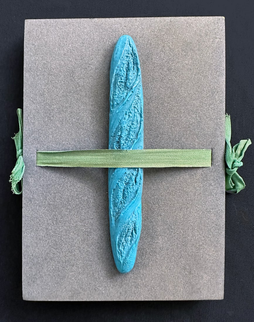 MAN RAY. Le Pain Peint. Artist Book with multiple and 10 silkscreens.: Galerie Iolas, 1973. Accordion fold book featuring one multiple, a blue baguette bread, on the front cover, held by a green ribbon to close the book. Also included in the book, ten silkscreen, after R