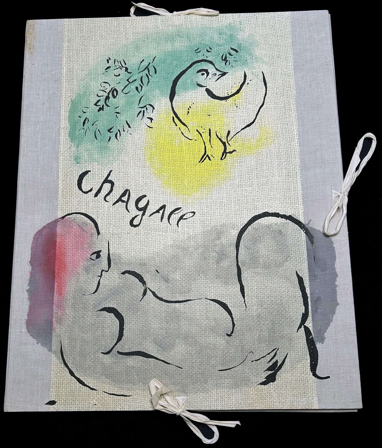 Chagall, Marc. Couleur Amour 13 Aquarelles. Gouaches, Lavis de Marc Chagall.: Au Vent d'Arles. Paris 1958 Preface by Jean Cassou. Large portfolio with 13 pochoirs realized by Daniel Jacomet after Chagall art works. Limited and numbered edition of 300 copies in Arabic + 20 out o