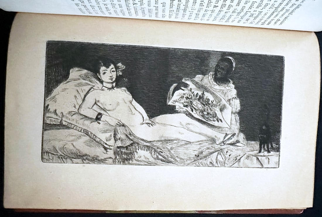 Manet by Zola. 1867. with Manet etching Olympia.: Edouard Manet. Zola, Emile. Dentu Paris, 1867. With one original etching by Manet "Olympia", and one etching by Bracquemond “Portrait of Manet". Rebounded with the original blue cover preserved insi