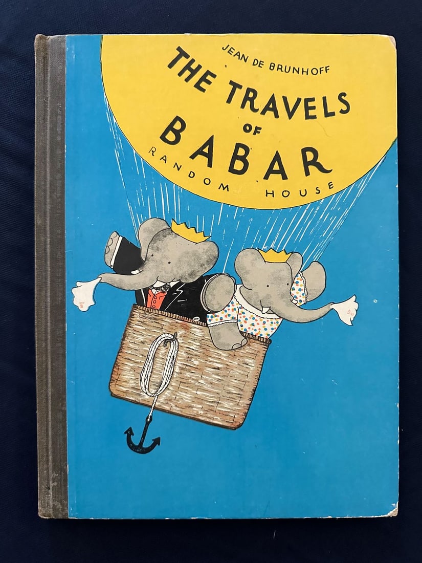 The Travels of Babar, by Jean de Brunhoff, 1934.: Random House, New York. Text in English. First American Edition. 48 pgs. Black- cloth backed blue pictorial boards depicting Babar and Celeste ascending in a hot air balloon, edges rubbed, corners