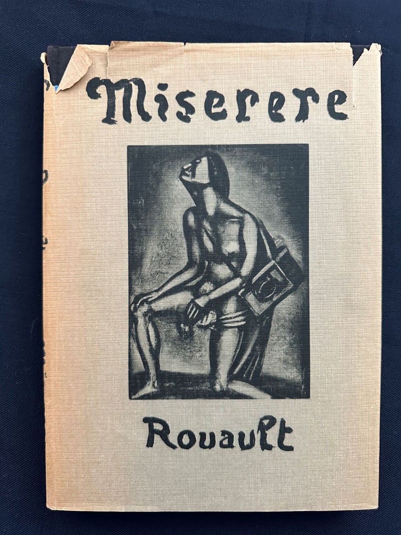 Miserere, by Rouault.: The Museum of Modern Art, New York, 1952 (first edition is in 1948). Preface by the artist and introduction by Monroe Wheeler. The jacket (worn, tears) has been designed by the artist. The 62 plates i