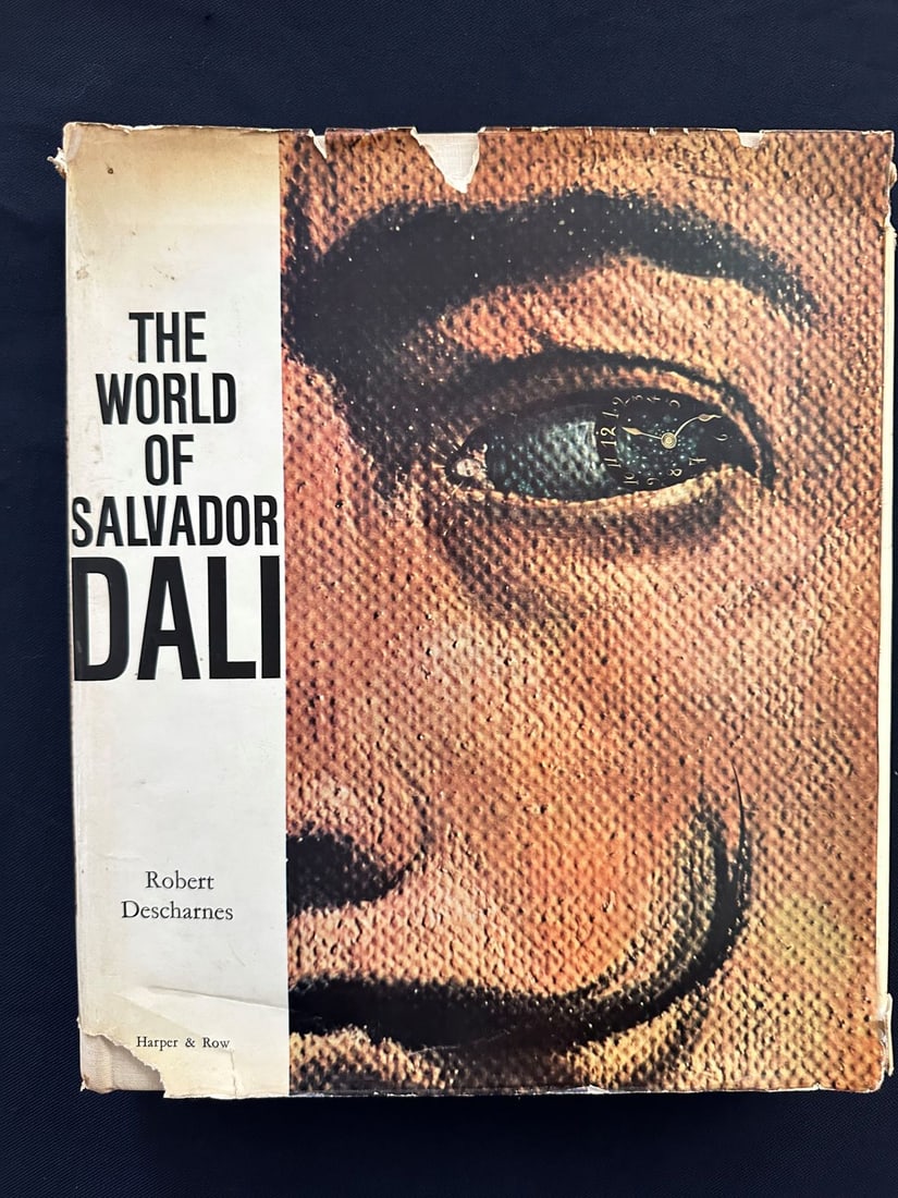 The World of Salvador Dali, by Robert Descharnes.: First Edition. Harper and Row Publishers, New York and Evaston. Includes many photographs and illustrations in color. Hardcover and worn dust jacket.