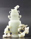 A PALE-GREY JADE VASE AND COVER QING