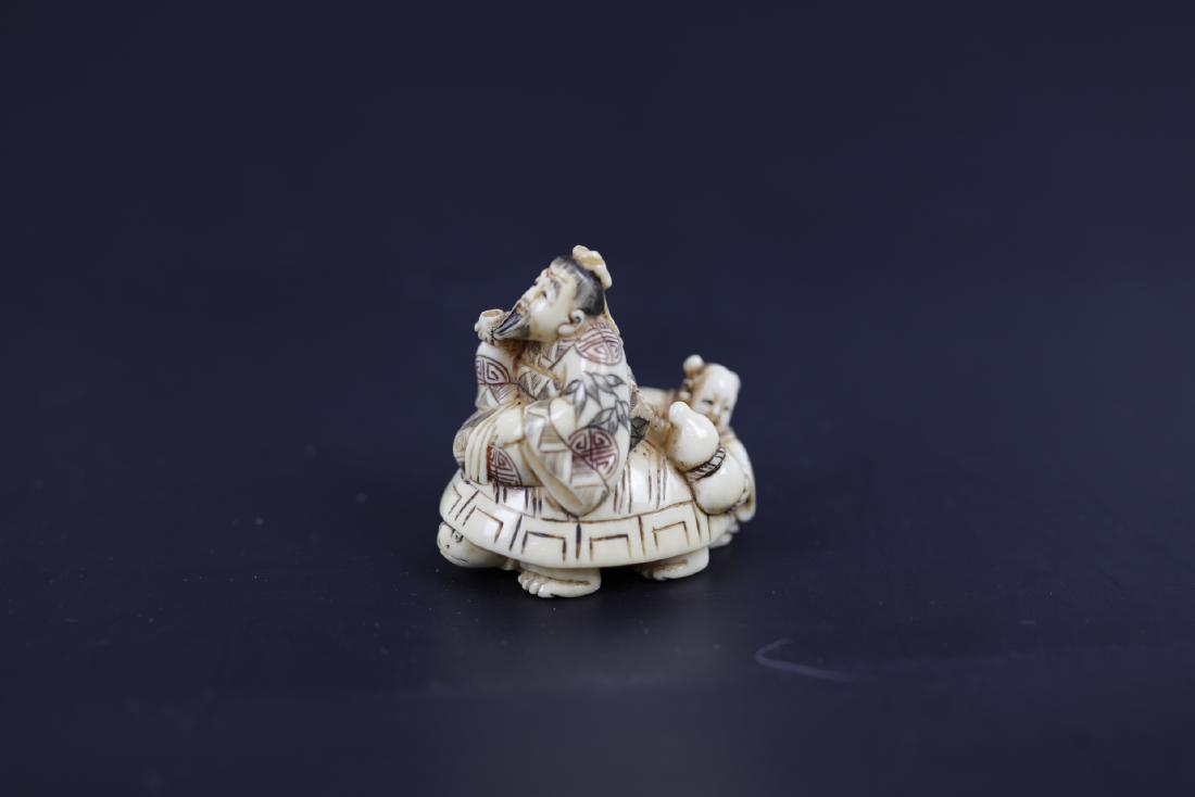 A Carved Netsuke of an Immortal and A Child Riding a (1 of 4)