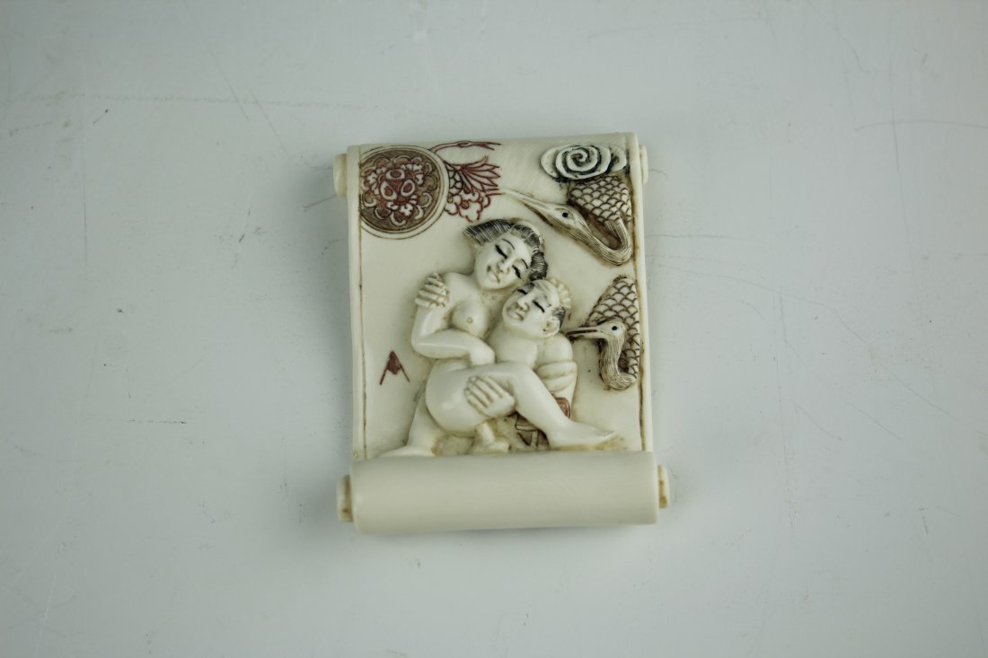 Carved Cattle Bone Erotic Netsuke Man and Woman Sex: Carved Cattle Bone of Erotic Netsuke High Roller Carving of Man and Woman Having Intercourse on a Scroll. H: 1.925 W: 1.5 Inches