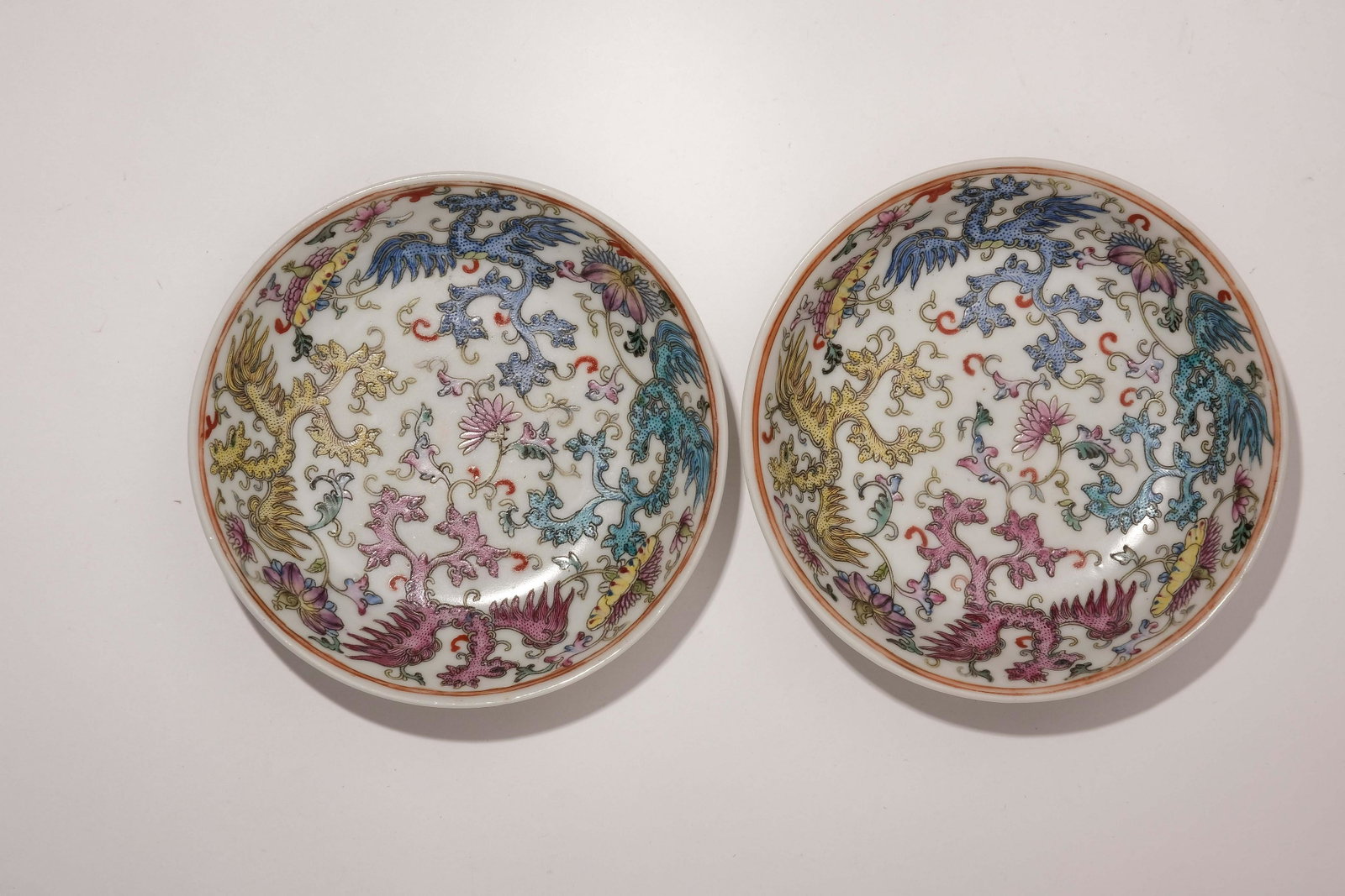 A Pair of Famille Rose Dragon Pattern Saucers with: A Pair of Famille Rose Dragon Pattern Saucers with Jiaqing Mark. D: 3.9 in. (10 cm)