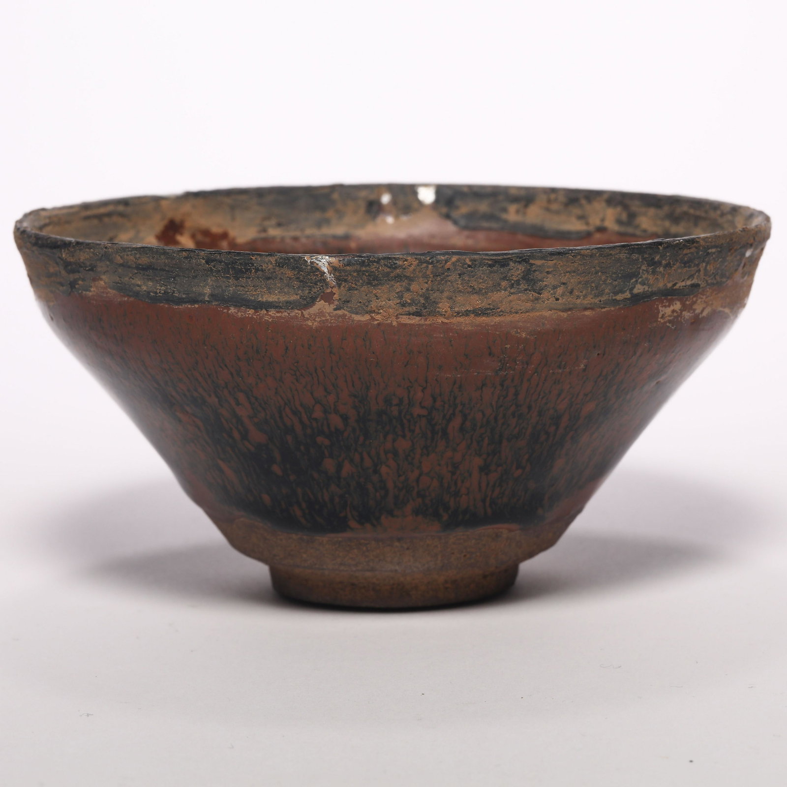 A Jian Hares Tea Bowl with Silver Rims: A Jian Hares Tea Bowl with Silver Rims. H: 2.5 in. (6.5 cm) D: 5 in 12.8 cm) We are not a professional appraisal agency nor restoration agency. The marking of the age and the review of the appearance 