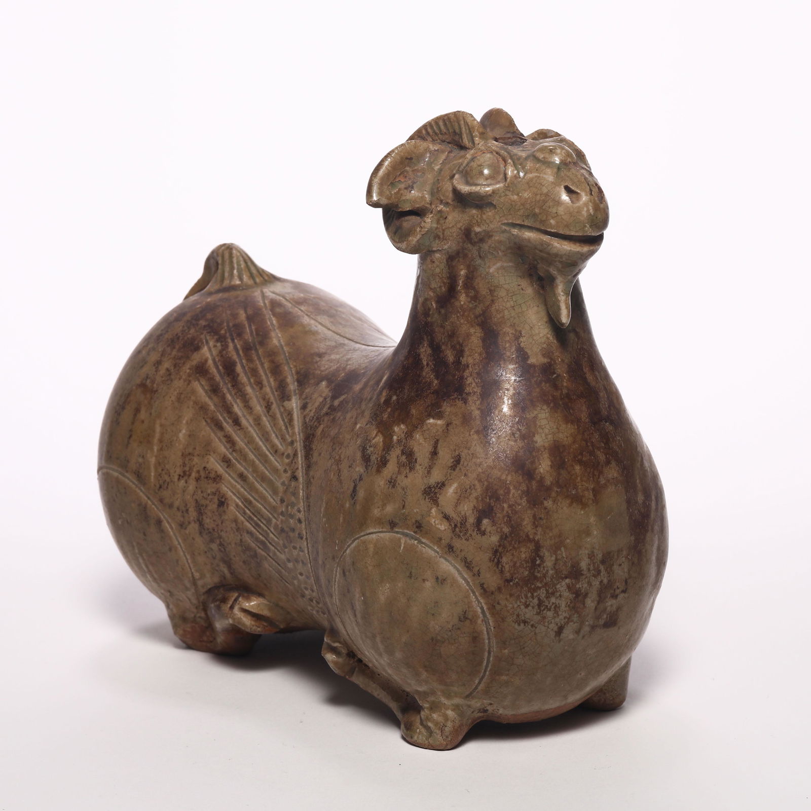 A Celadon Sheep Figure: H: 4.7 in. (12cm) D: 7in (18 cm) We are not a professional appraisal agency nor restoration agency. The marking of the age and the review of the appearance are just our subjective judgments. Therefore