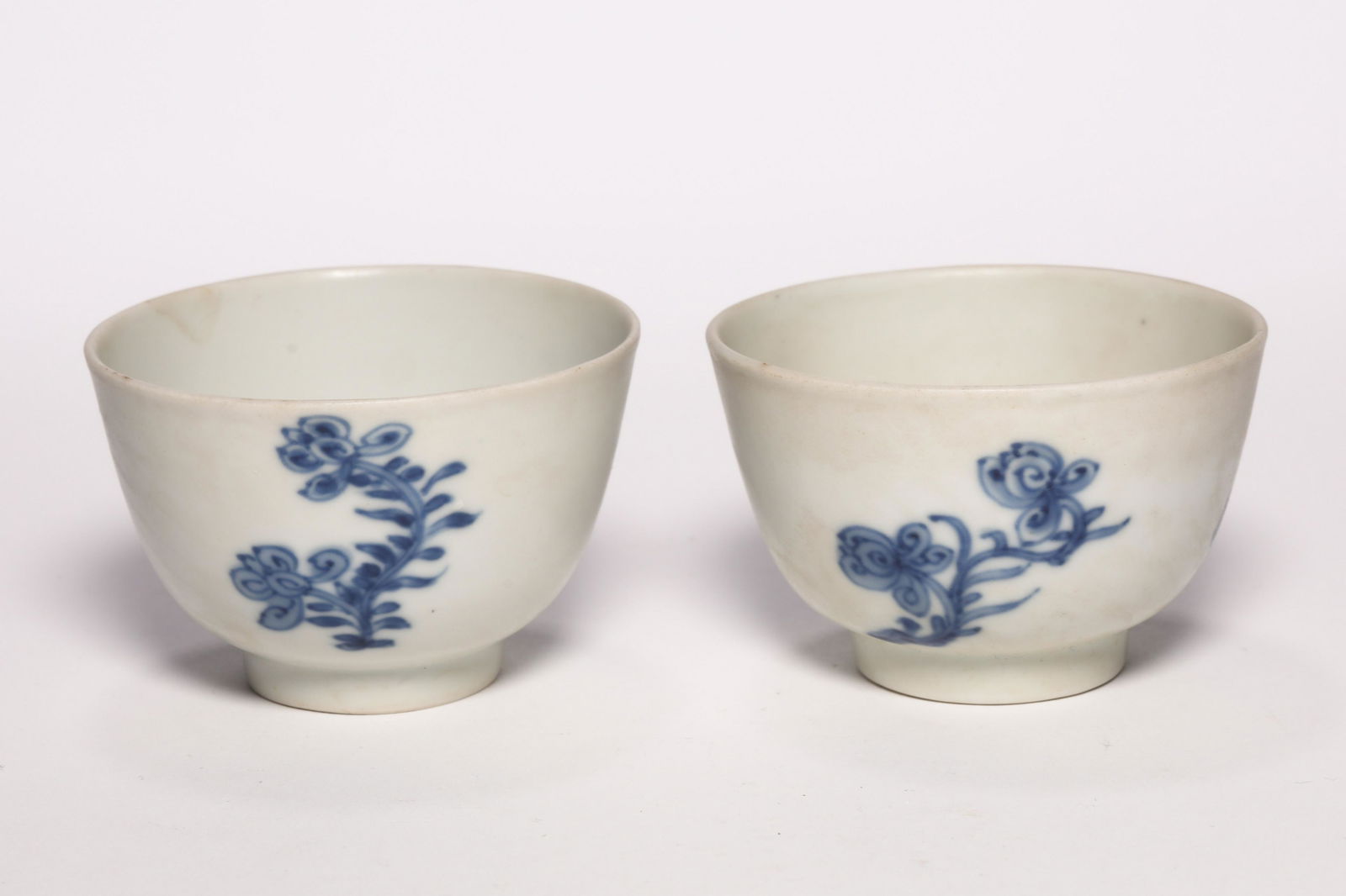 Pair Blue and White Flower Cups: Pair Blue and White Flower Cups. H: 1.6 in. (4.2 cm) D: 2.5 in (6.5 cm)