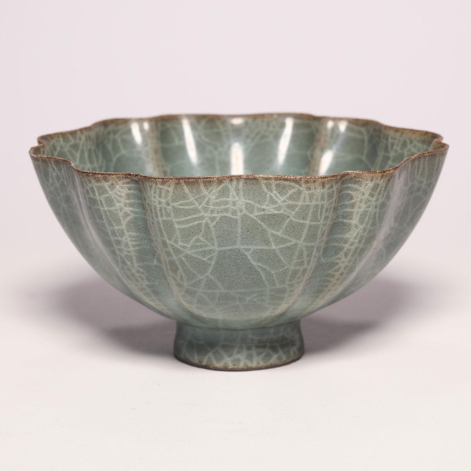 Longquan Celadon Lobed Tea Bowl: Longquan Celadon Lobed Tea Bowl. H: 2.1 in. (5.3 cm) D: 4.1 in (10.5 cm)