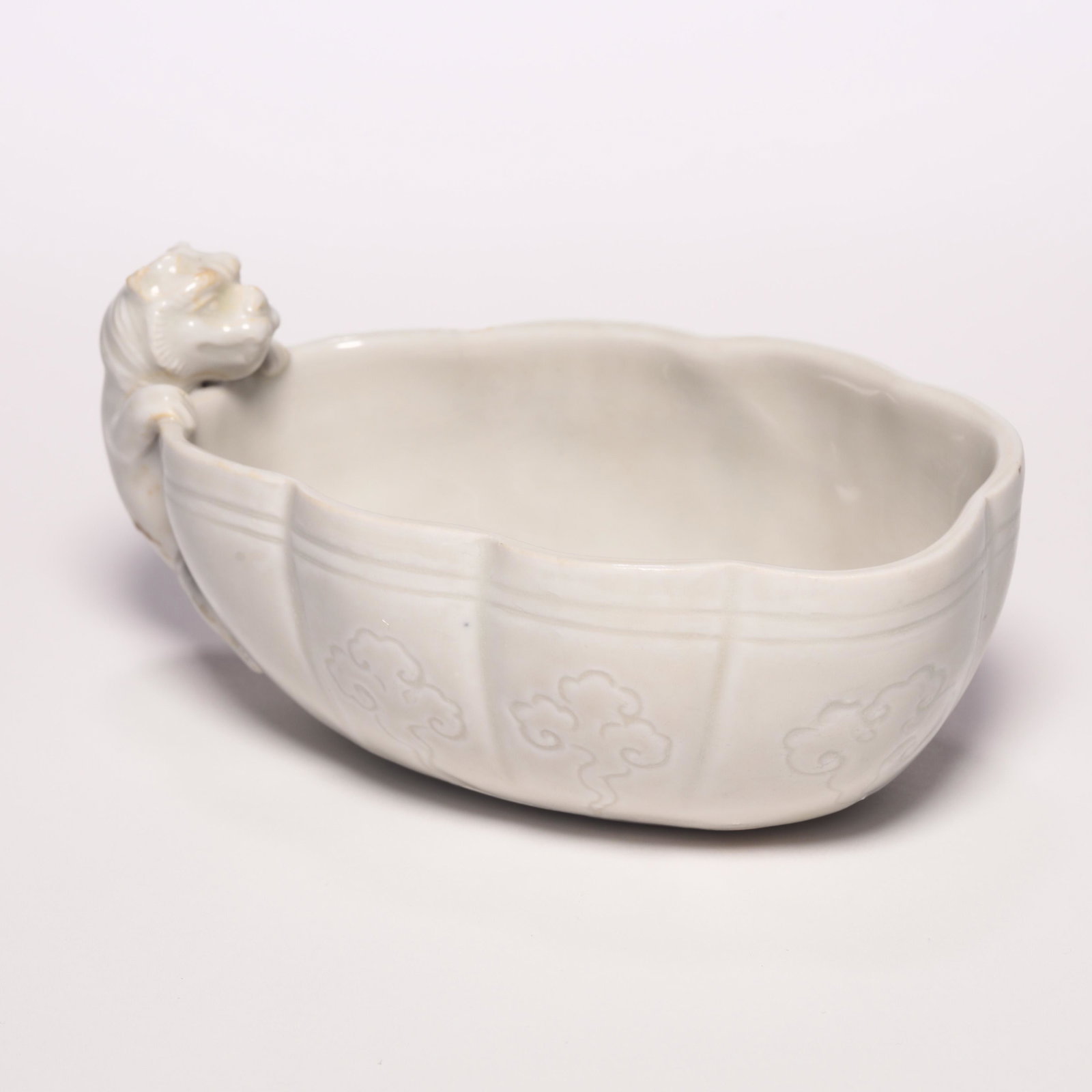 A Dehua Ware Carved Flower Brush Washer: A Dehua Ware Carved Flower Brush Washer. H: 2.2 in. (5.8 cm) W: 4.6 in (11.8 cm) D: 2.7 in (7 cm)