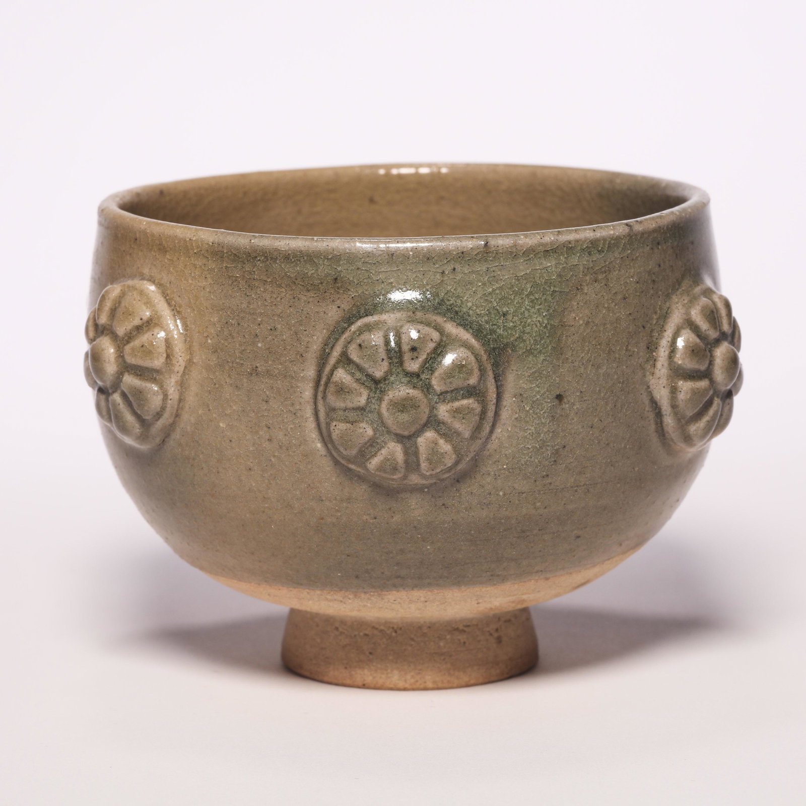 A Brown Glazed Carved Flower Cup: A Brown Glazed Carved Flower Cup. H: 3 in. (7.5 cm) D: 4.3 in (11 cm)