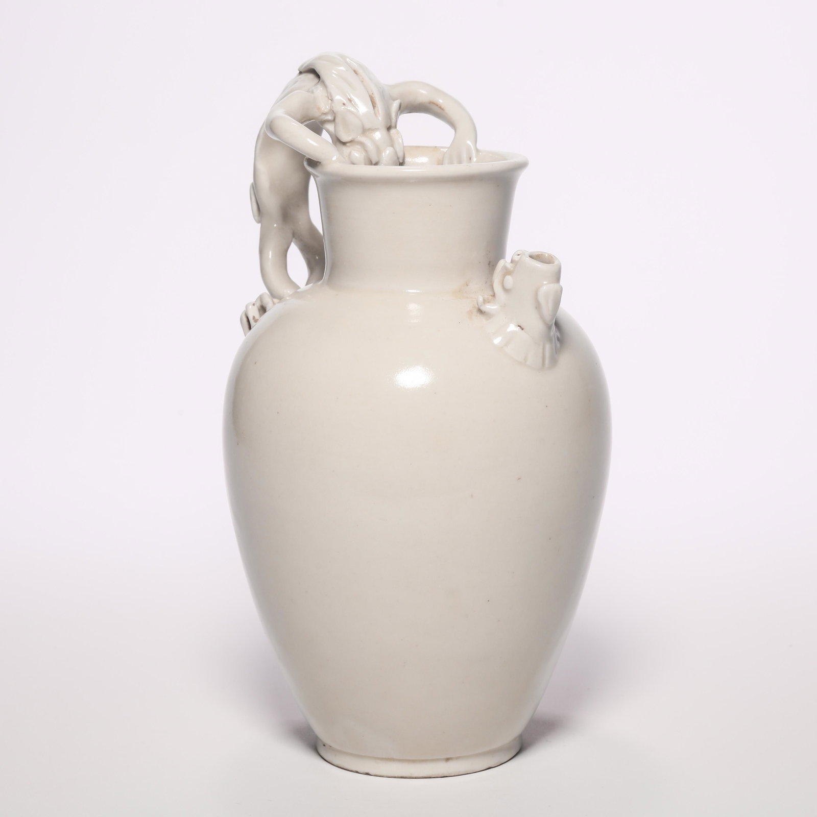 A Ding Dragon-Formed Handle Pot: A Ding Dragon-Formed Handle Pot. H: 7.4 in. (19 cm)