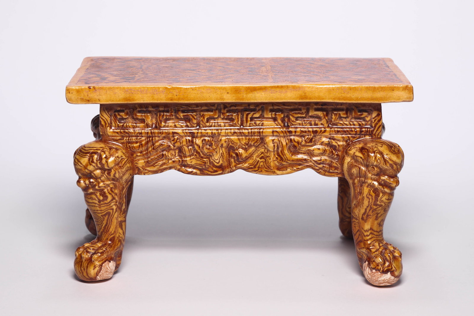 A Twisted Glazed Offering Table: A Twisted Glazed Offering Table. H: 3.9 in. (10 cm) W: 6.3 in (16 cm) D: 3.2 in (8.2 cm)