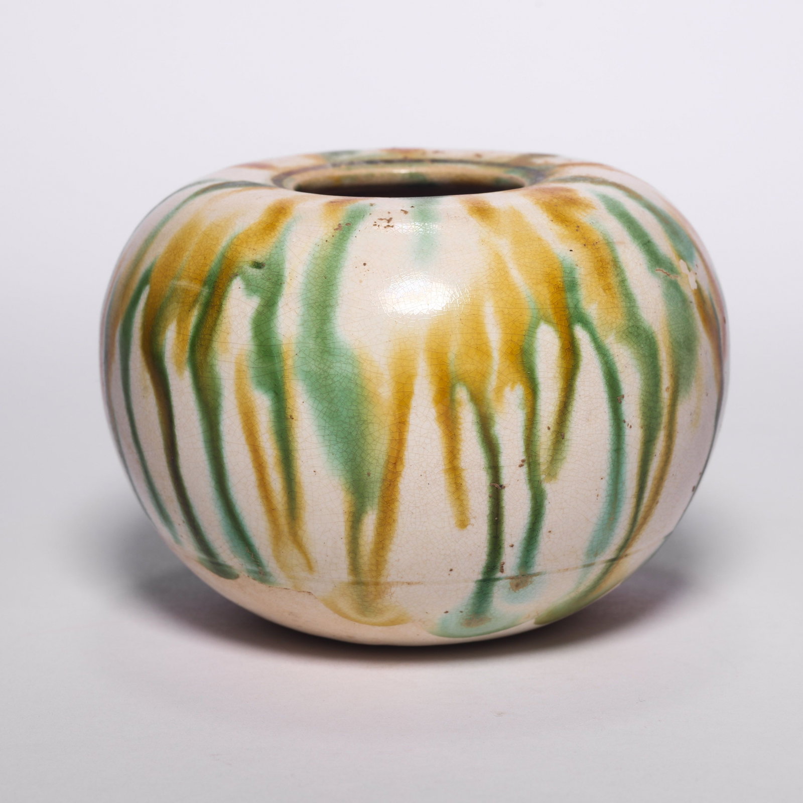 A Sancai Pouring Glaze Water Droplet: A Sancai Pouring Glaze Water Droplet. H: 2.4 in. (6 cm) D: 3.3 in (8.5 cm)