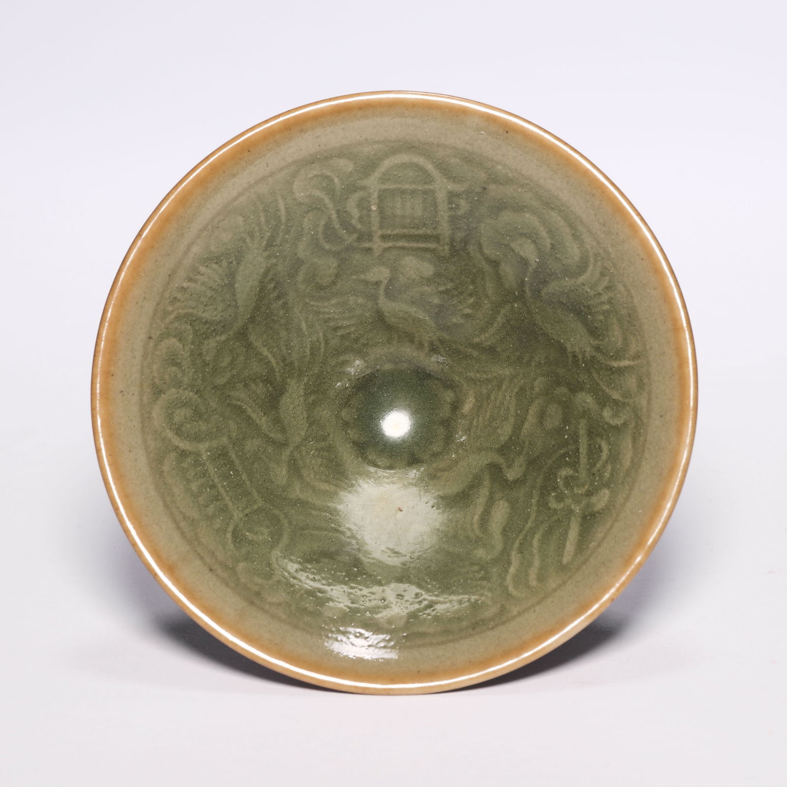 A Celadon Glazed Bowl With Phoenix: A Celadon Glazed Bowl With Phoenix. H: 2.3 in. (6 cm) D: 4.3 in (11 cm)