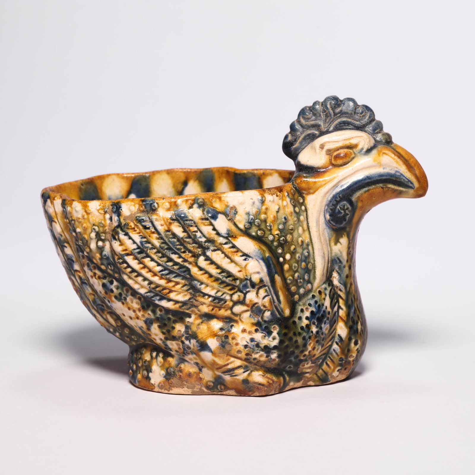 A Sancai Chicken Shaped Wine Cup: A Sancai Chicken Shaped Wine Cup. H: 3.9 in. (10 cm) D: 5.5 in (14 cm)
