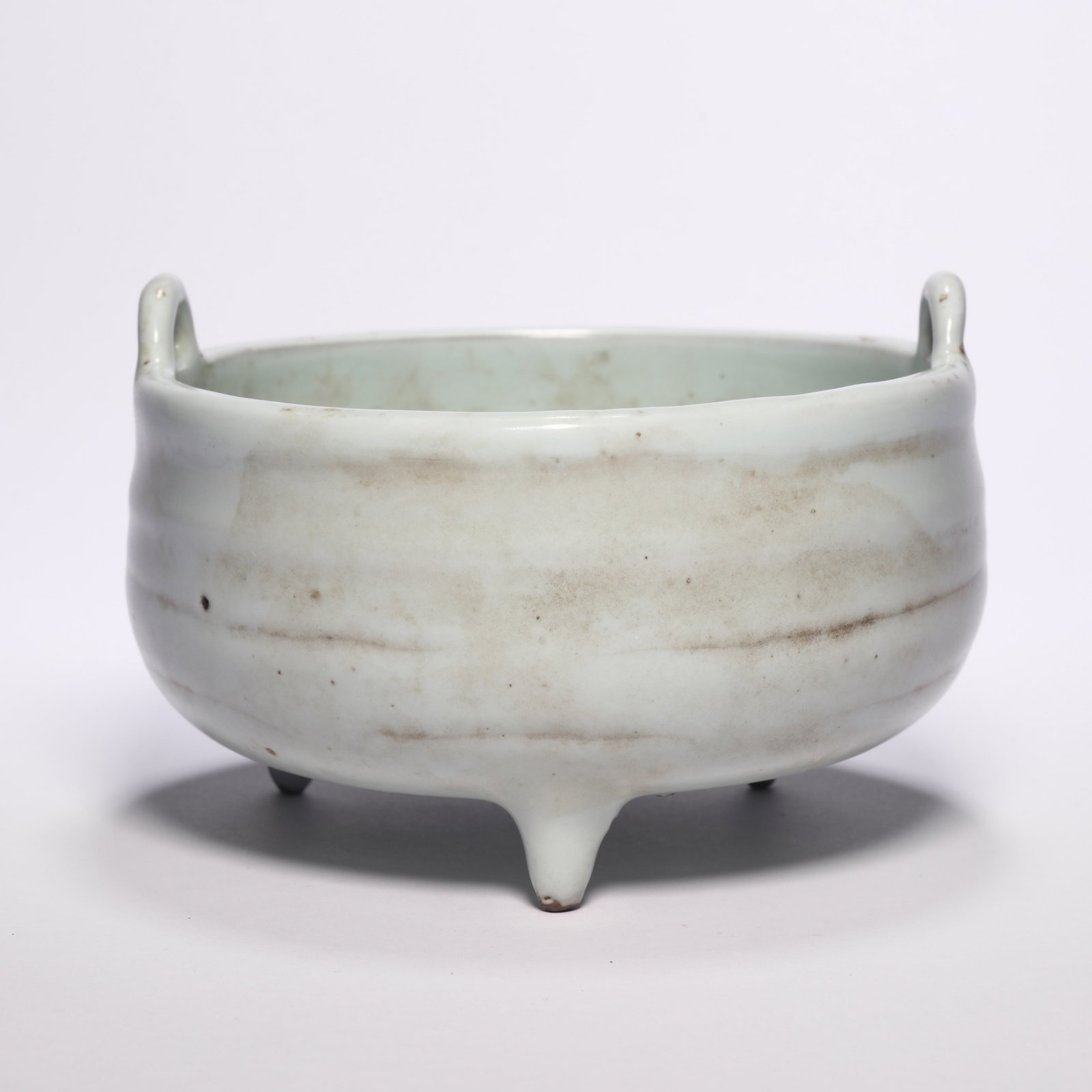 A Ding Porcelain Incense Burner With Handles: A Ding Porcelain Incense Burner With Handles. H: 3.1 in. (8 cm) D: 5.9 in (15 cm)