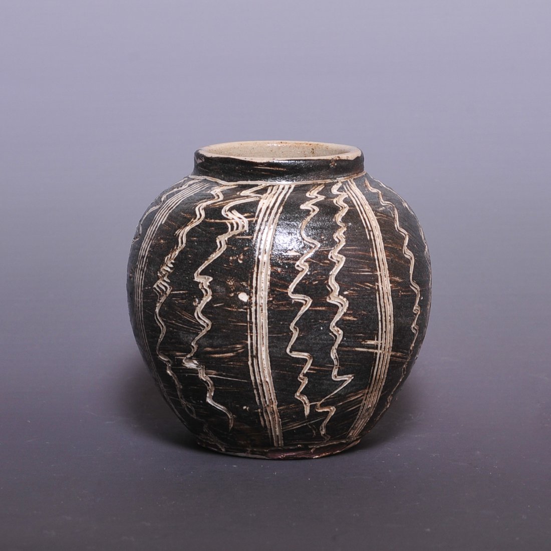 10th Song Dynasty Jizhou kiln 'Watermelon' Jar: 10th Song Dynasty Jizhou kiln 'Watermelon' Jar China, Possibly Song Dynasty (10th Century) A Jizhou kiln jar, modelling design like a watermelon. Song Dynasty Jizhou kiln watermelon jar;size;3.5 x 3.4