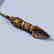 A TIBETAN GILT-BRONZE INSTRUMENT - 2