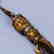A TIBETAN GILT-BRONZE INSTRUMENT - 5